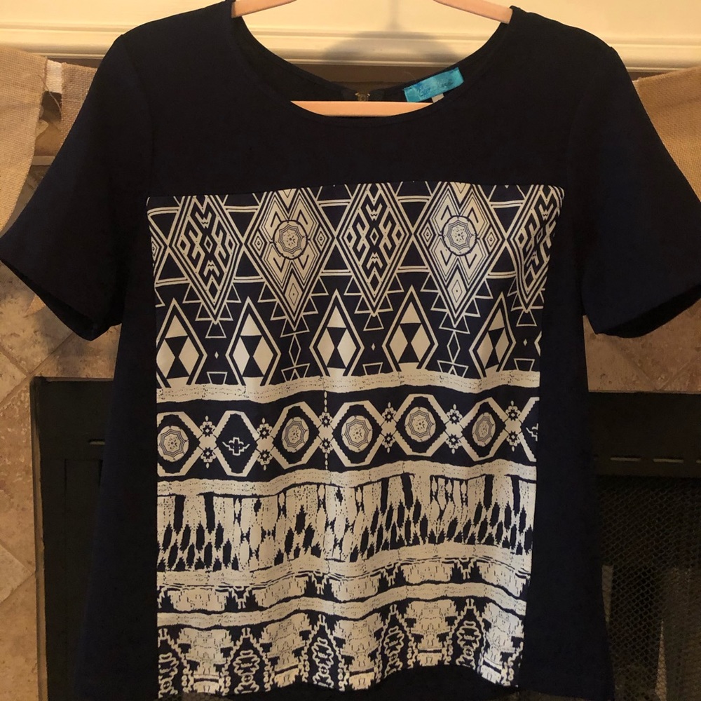 Boutique navy top with Aztec detail.
